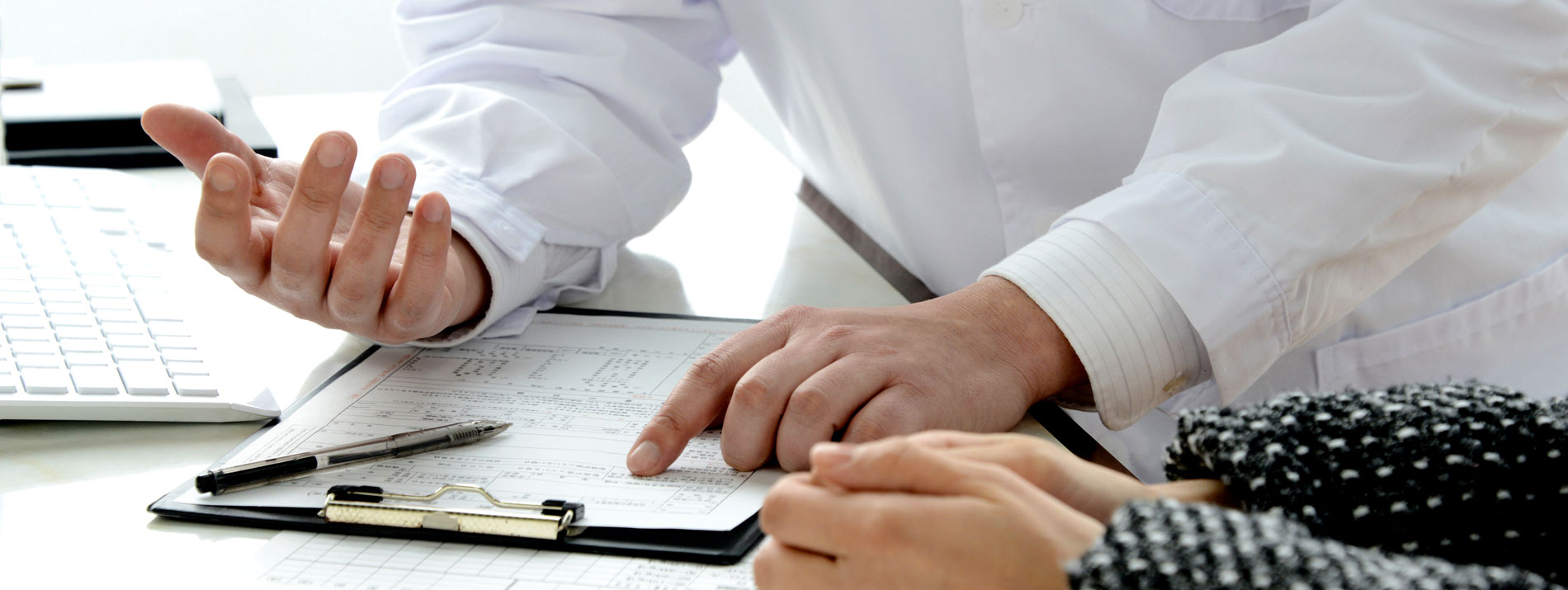 Doctor explaining patient support hero